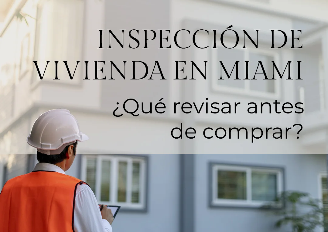 Inspector de vivienda con casco y chaleco naranja revisando edificio residencial en Miami antes de comprar